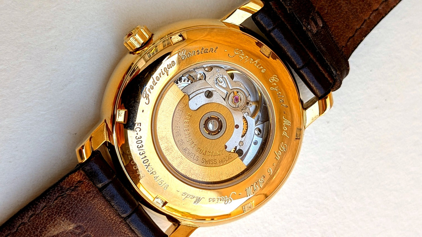 Frédérique Constant Classics fond saphir laissant voir le mouvement automatique, boîtier doré, montre habillée homme