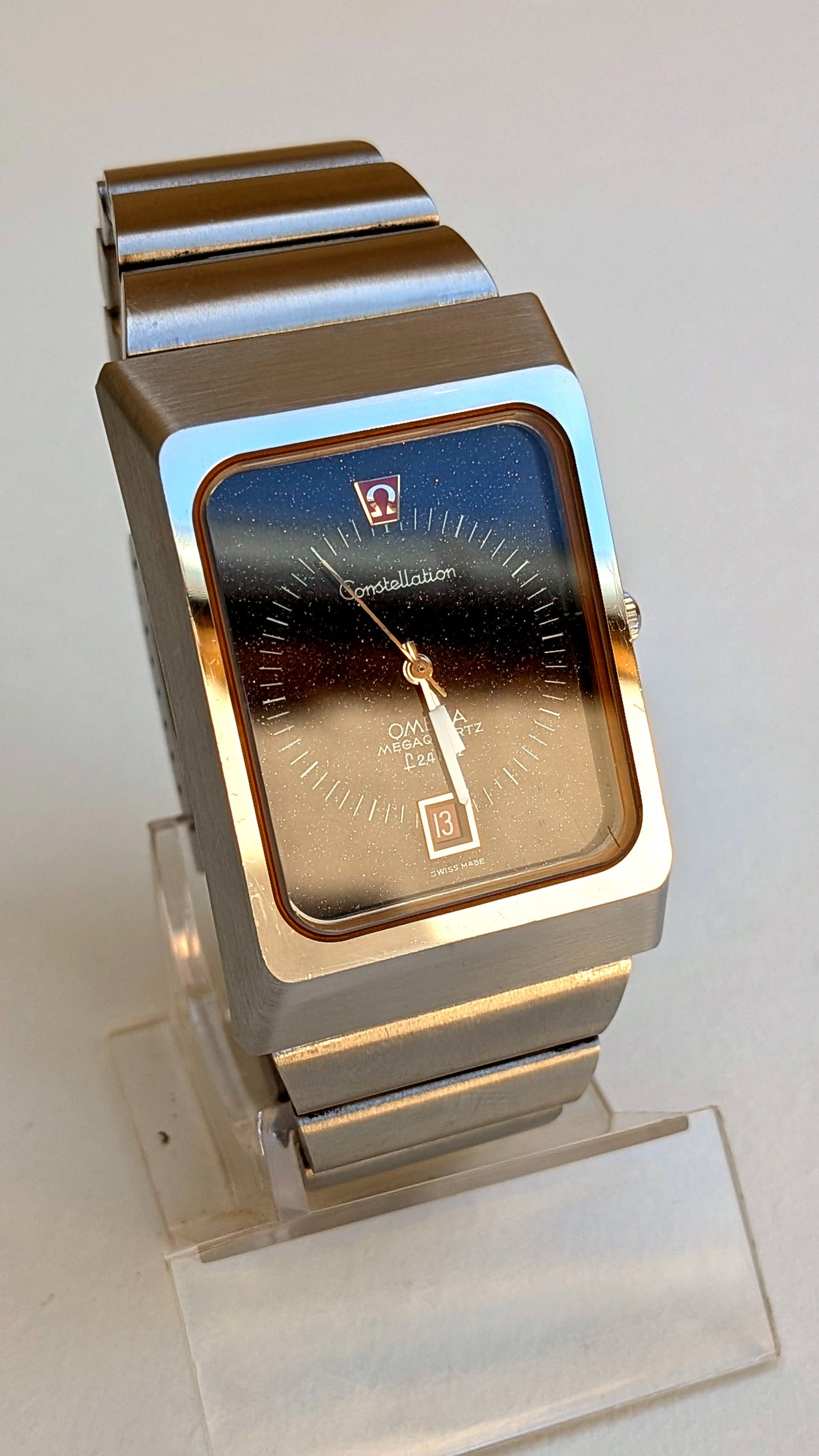 Omega Constellation Megaquartz boîtier rectangulaire cadran aventurine, bracelet acier intégré, montre vintage homme