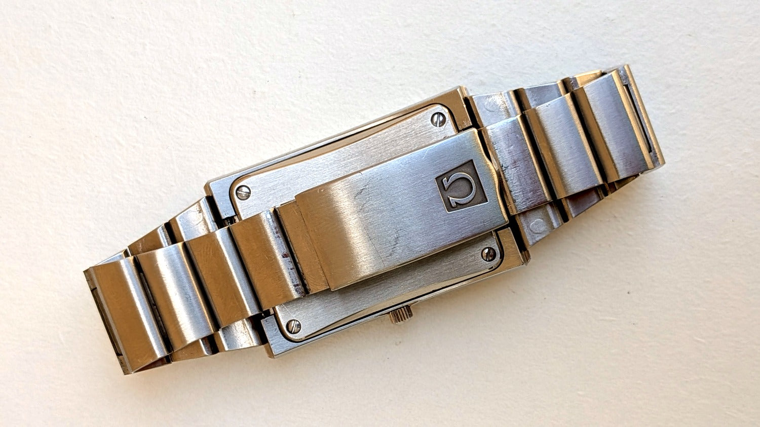Omega Constellation Megaquartz fond de boîte et fermoir acier logo Oméga, bracelet intégré, montre vintage homme
