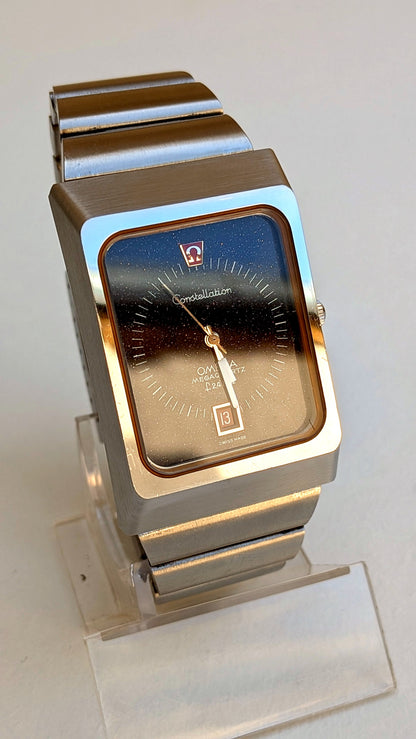 Omega Constellation Megaquartz boîtier rectangulaire cadran aventurine, bracelet acier intégré, montre vintage homme